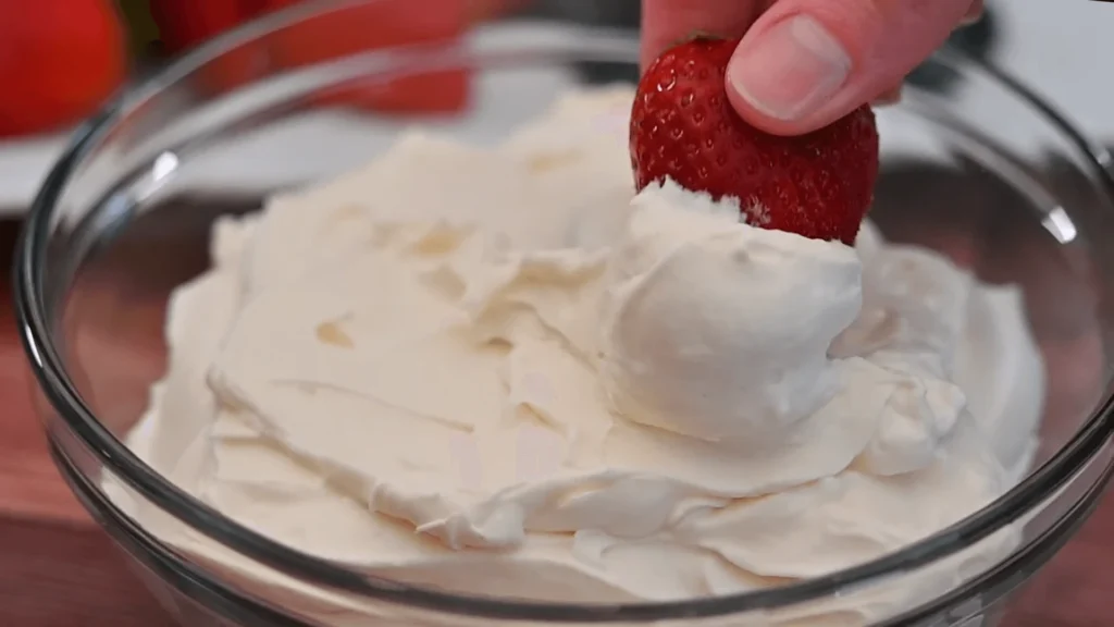 Creamy 3-ingredient fruit dip served with fresh fruits like strawberries, grapes, and apple slices.