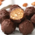 Close-up of delicious homemade pecan pie balls on a plate, perfect for a sweet treat.